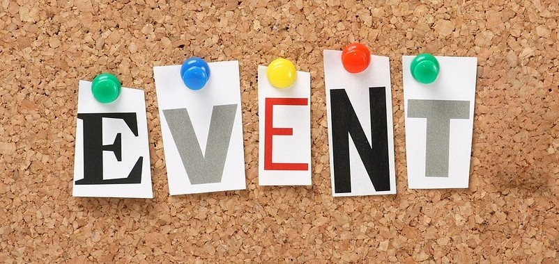 The word EVENT in cut out magazine letters pinned to a cork notice board.